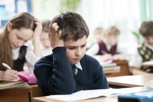 boy struggling in school - medium